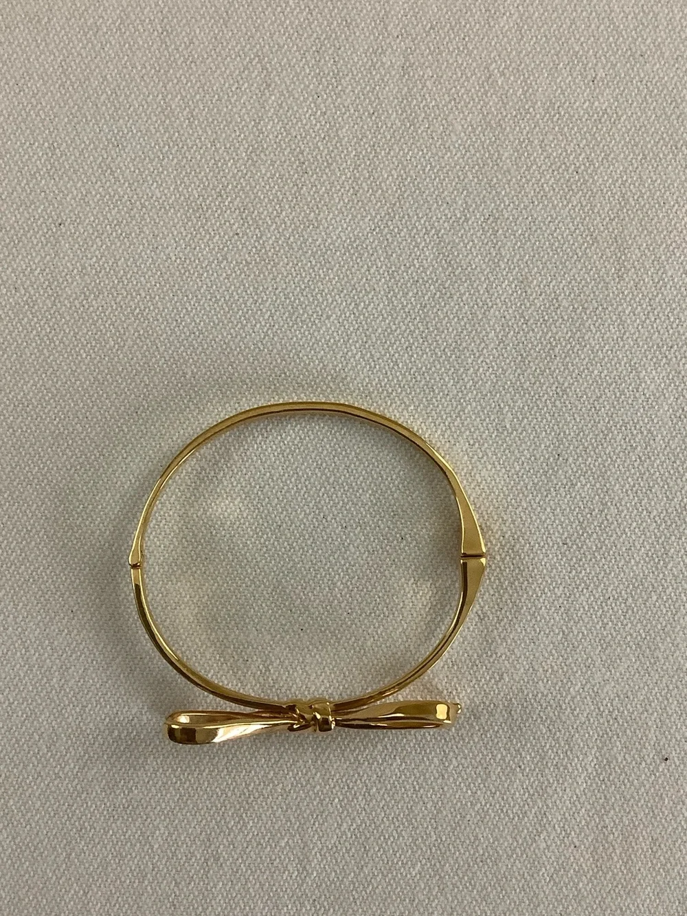 kate spade gold-tone bow hinged bangle bracelet